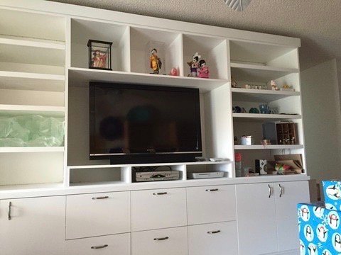 Project Gallery White built-in media center with open display shelving and integrated TV