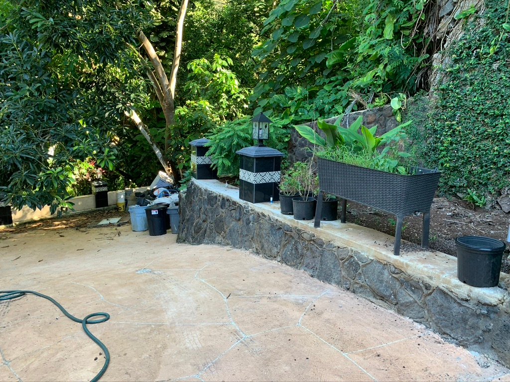 Project Gallery Stacked stone patio wall with multi-pier lantern lighting arrangement