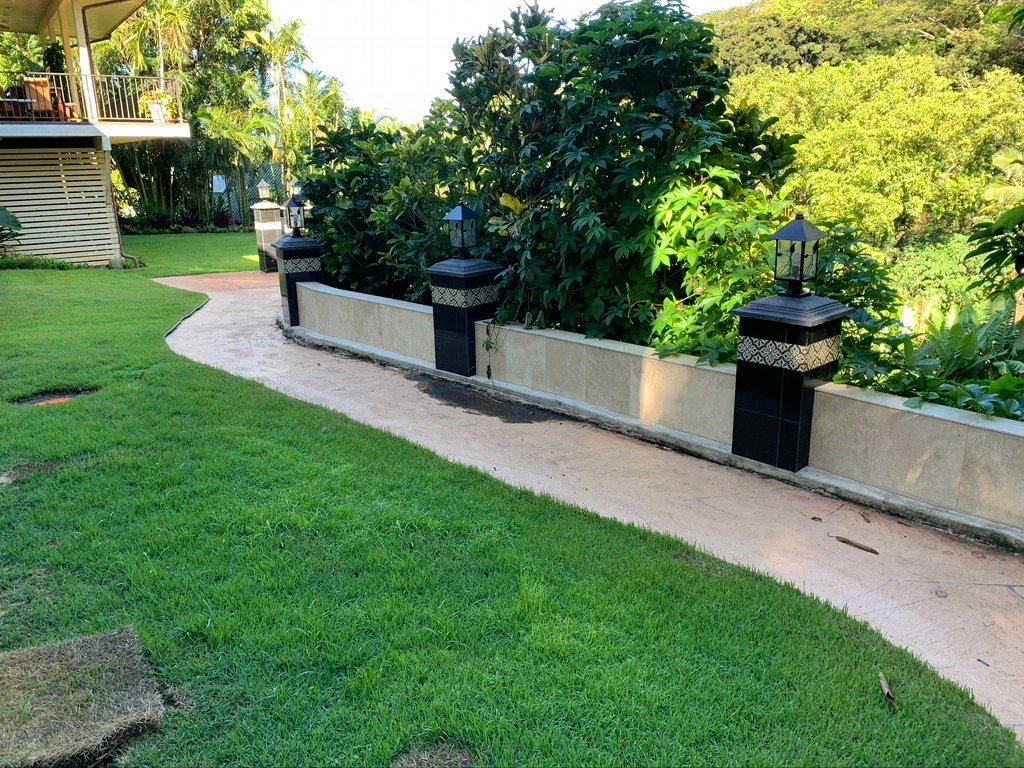 Project Gallery Granite piers along a garden wall with tropical landscaping