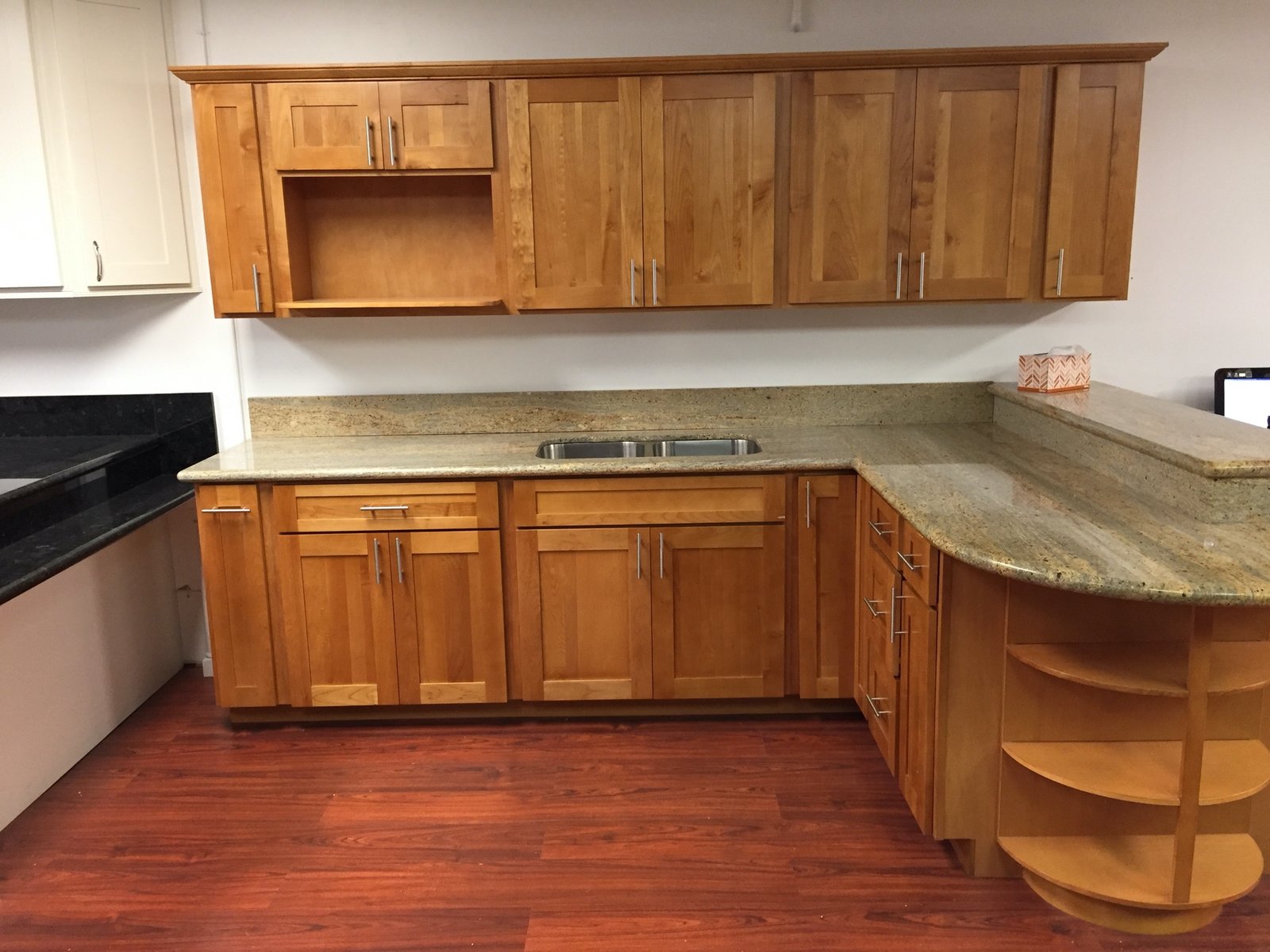 Project Gallery Curved bar counter with open shelving and granite bar top
