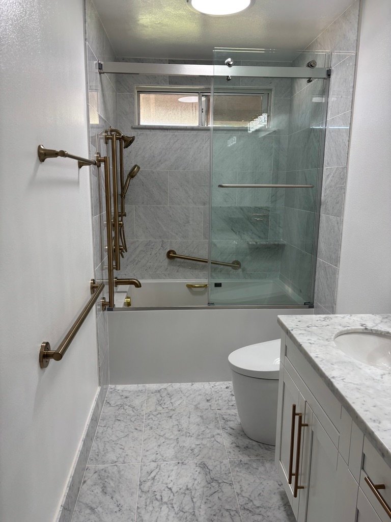 Project Gallery Full marble bathroom suite overview with shower, toilet, and vanity