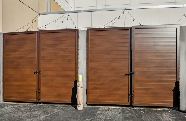 Project Gallery Woodgrain aluminum double enclosure doors at a restaurant patio storage area
