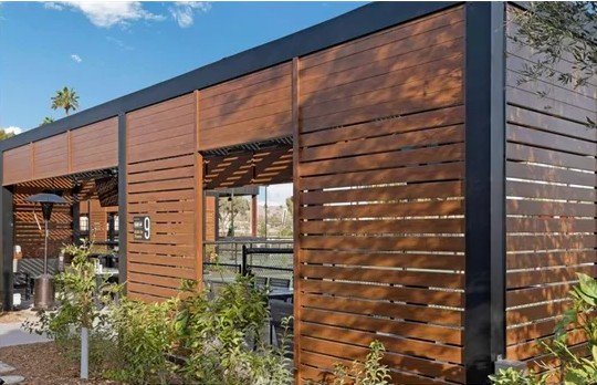 Woodgrain aluminum horizontal screen wall facade with steel framing