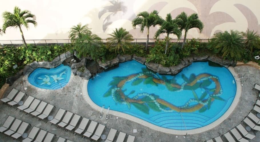 Project Gallery Aerial view of lagoon-style pool with custom mosaic tile design